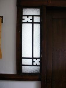 Decorative Window beside the Entrance Door